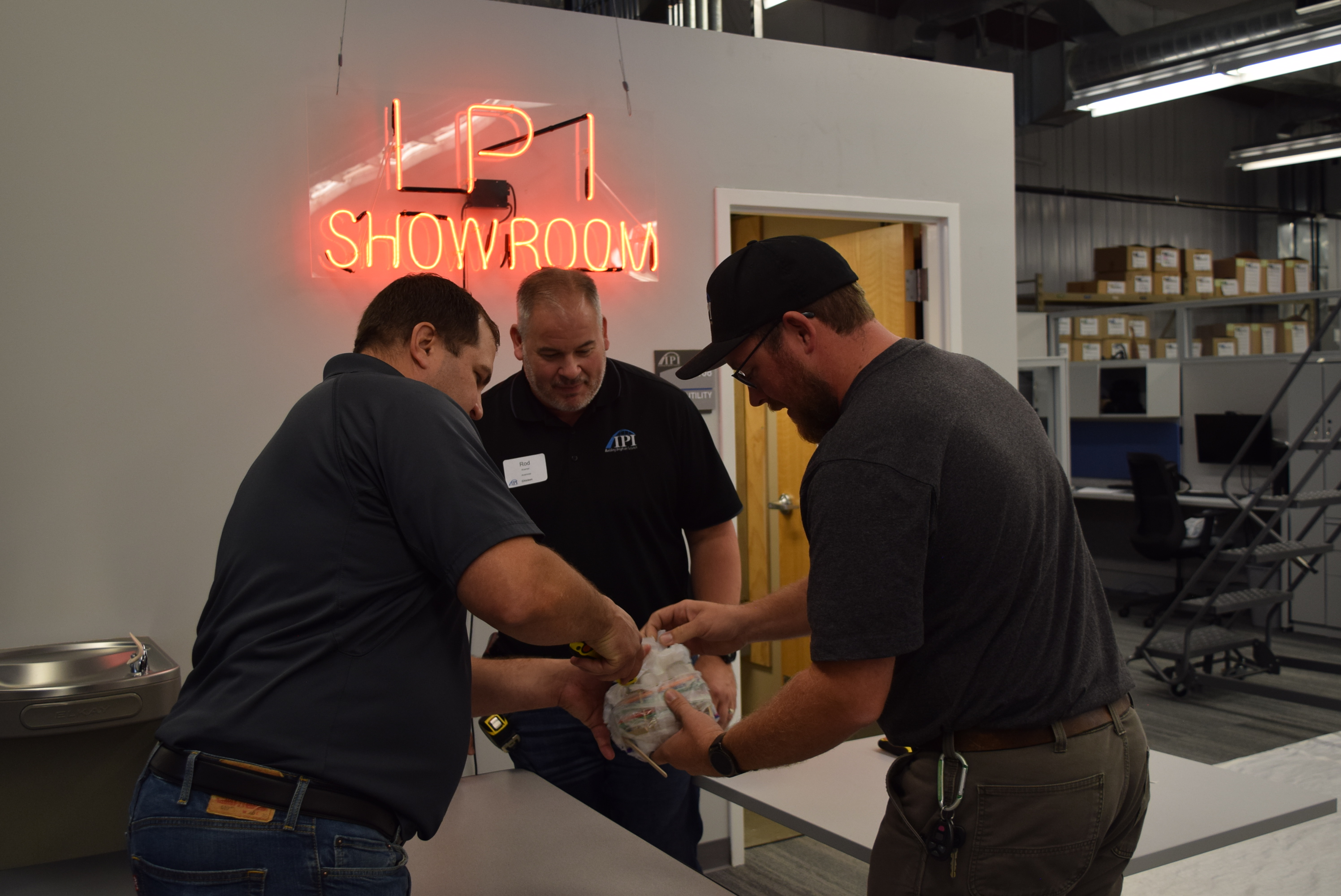Image of Egg Drop judges opening an egg package